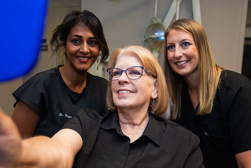 Patient and doctor looking into mirror