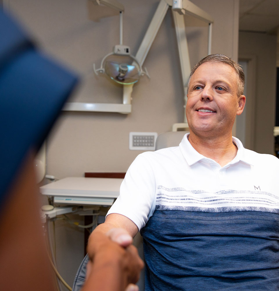 Patient shaking doctors hand